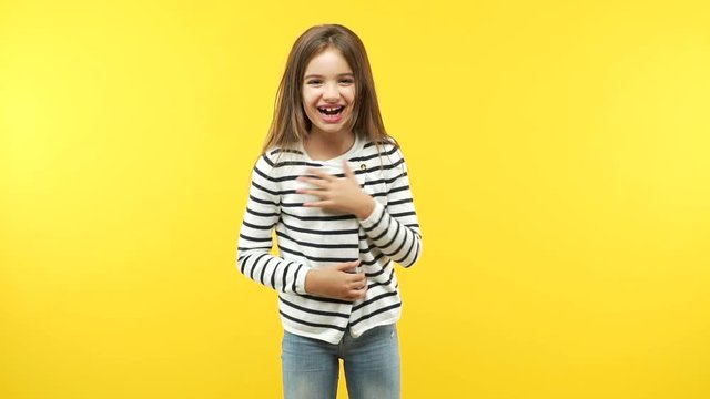 Funny little child girl laughing and having fun