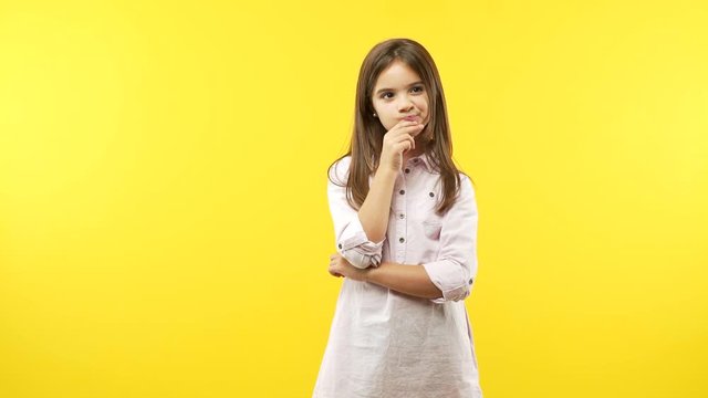 Funny little child girl doubting and confused