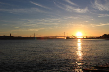 sunset over the sea with bridge
