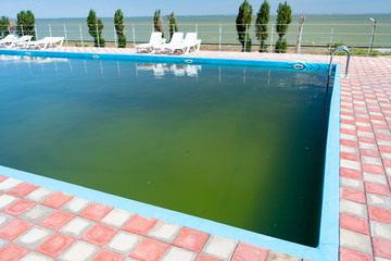 Dirty pool with green water. poor service at resort. unsanitary conditions.