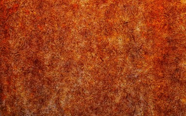 Surface textured orange background in grunge style with space for text