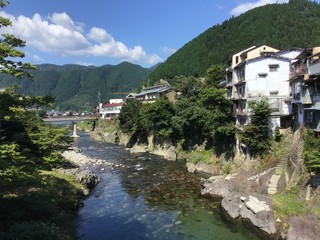 Fototapeta na wymiar Scenery near Miyagase Bridge over the Yoshida River in Gujo Hachiman