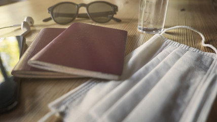 Coronavirus and travel concept. Note COVID-19 and passport. Novel corona virus outbreak. The spread of epidemic from Wuhan, China. Border control and