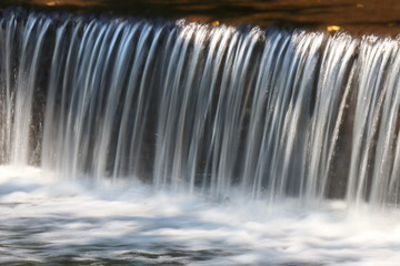 water flowing from the waterfall