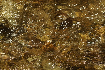clear water flows fast into the strean