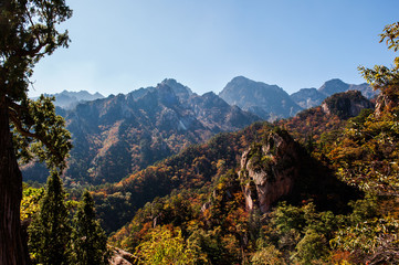 The landscape of autumn mountain background blue sky.
