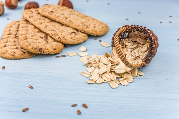 oval cookies with cereals, oatmeal and nuts on the table