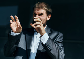 Business man in suit gestures with hand emotions outdoors lifestyle