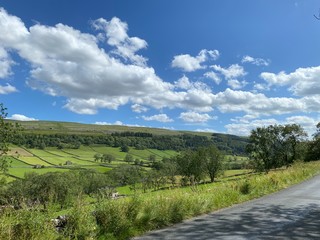 Landscape view, of trees, fields, meadows, and old barns near, West Burton, Leyburn, UK