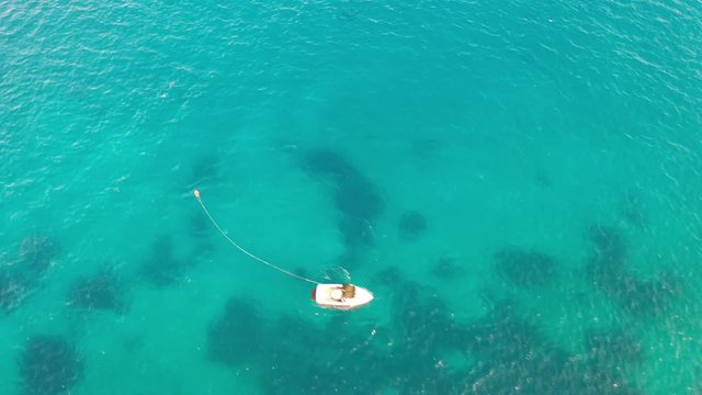 Aerial view of a motor boat towing a water skier. Elounda, Crete, Greece