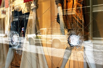 Greece, Athens, June 28 2020 - Broken glass of store window at Ermou street, in the commercial...
