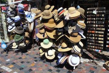 Greece, Athens, June 17 2020 - Hats stacked on stands outside store at Monastiraki square.