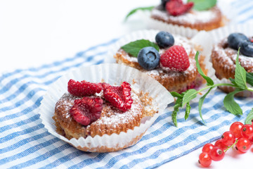 Mixed berry fruit muffins in paper cups