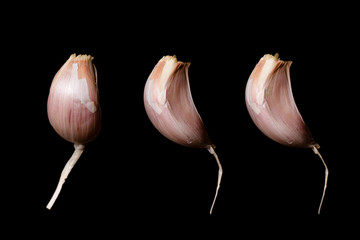 set of garlic on a black background
 - obrazy, fototapety, plakaty