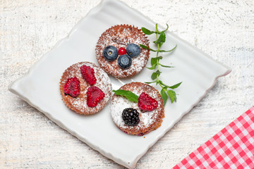 Mixed berry fruit muffin desserts on a plate