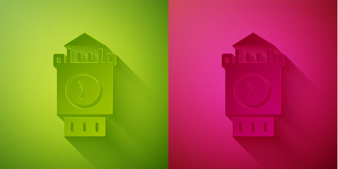Paper cut Big Ben tower icon isolated on green and pink background. Symbol of London and United Kingdom. Paper art style. Vector.