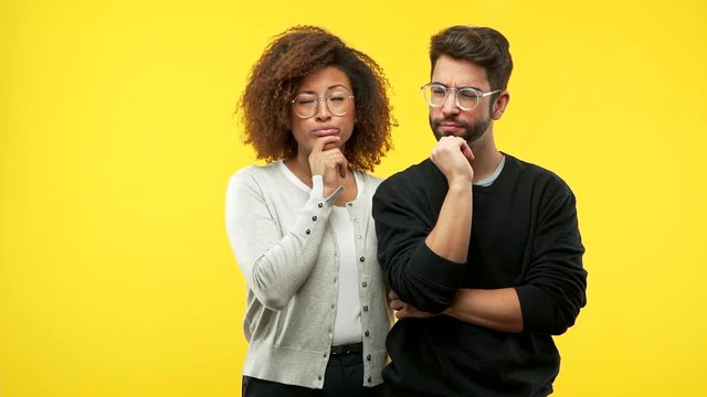 young black woman and caucasian man doubting and confused