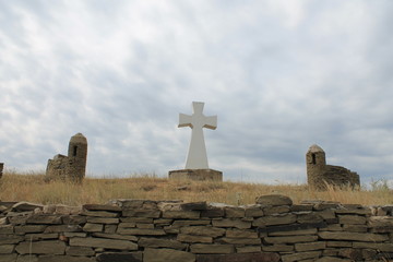 The memorial stone cross in the steppe