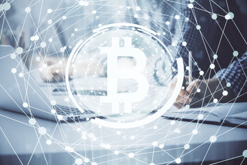 Blockchain theme hologram with man working on computer on background. Concept of crypto chain. Double exposure.