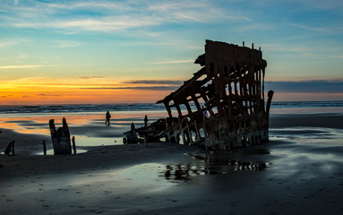 The wreck of the Peter Iredale at sunset on the Oregon coast near Warrenton.