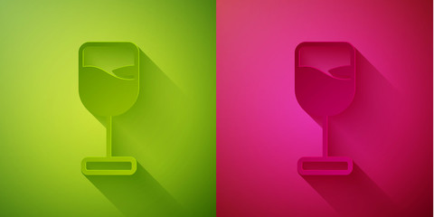 Paper cut Wine glass icon isolated on green and pink background. Wineglass icon. Goblet symbol. Glassware sign. Happy Easter. Paper art style. Vector.