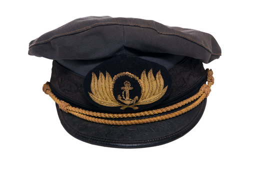 Old marine captain hat in a white background