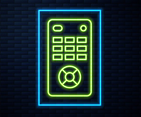 Glowing neon line Remote control icon isolated on brick wall background. Vector Illustration.