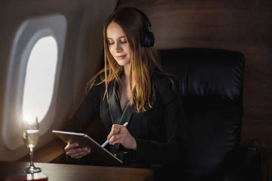Attractive woman in private jet