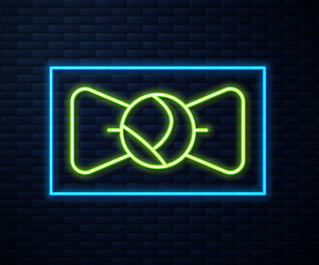 Glowing neon line Bow tie icon isolated on brick wall background. Vector.