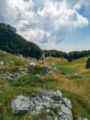 Fototapeta na wymiar Premuziceva Trail is a 57 km long hiking trail that leads along the Velebit across the craggy ground of the north and central Velebit mountain. Trails takes you to the wildest parts of the mountain.