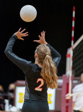 Girl Athletes Playing Volleyball During Covid-19, Wearing Masks For Protection