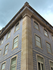 Lisbon, Portugal - Portuguese ceramic tiles on the facade. Building in Lisbon Portugal