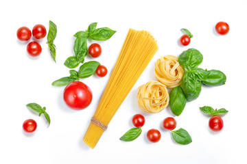 Cherry tomatoes, spaghetti and basil leaves on a white isolated background. Ingredients for pasta. Flat lay.