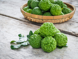 Close up bergamot on wooden table background, also for hair shampoo or conditioner treatment. Kaffir lime 