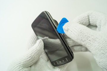Fototapeta premium Disassembly car camera to replace new battery on white background, isolated, Car maintenance service.