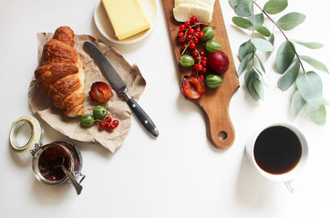French breakfast. fresh croissant, berries and fruits. Flat lay concept.