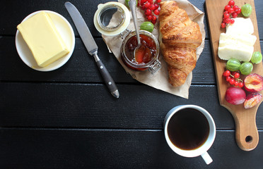 Fototapeta na wymiar French breakfast. fresh croissant, berries and fruits. Flat lay concept.