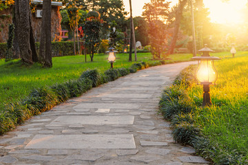 Paved stone path in the park or garden - 373144435