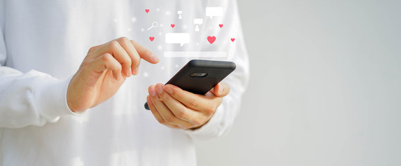 close up young man holding smartphone while using online dating application to greeting and talking with other for appointments to flirting for lifestyle people concept	