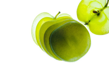 Slices of apple at the backlight isolated on a white background, macro photo