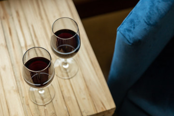 Two glasses of red wine on a table