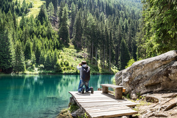 Photographer Man Taking Mountain Lake Photo