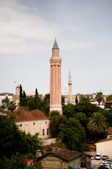 Fototapeta premium The minaret rises above the rooftops of the old town