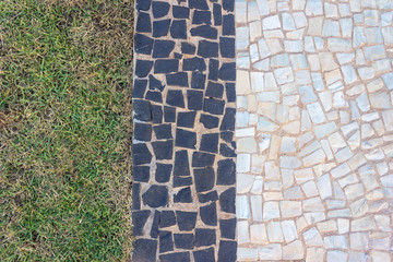 Fototapeta na wymiar Grass and Portuguese stone 