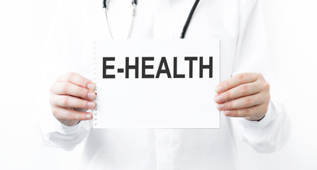 Doctor holding a card with E-Health medical concept