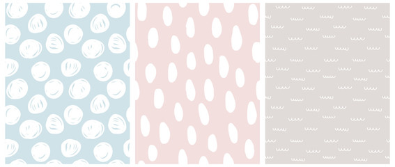 Simple Pastel Color Geometric Seamless Vector Patterns. Irregular Hand Drawn Doodle Print. Infantile Style Abstract Dotted Backdrop. White Spots, Waves and Dots Isolated on a Blue,Pink and Gray Backgr