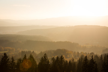 Fototapeta na wymiar Watching sunset over the forest from Slovanka lookout tower near Janov nad Nisou, Czechia