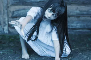 Wall murals Sweet Monsters Scary ghost girl pulling with her hand  and crept on the ground