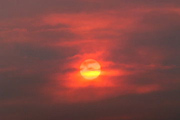 sun  through smoke from wildfire