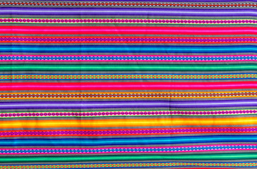 Peruvian traditional colourful handicraft textile fabric in Cusco, Peru